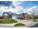 Charming two-story home featuring a well-manicured lawn and a driveway with ample parking space at 11699 Pink Phlox Dr, Parker, CO 80134