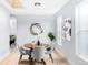 Light-filled dining room features wood table, gray chairs, and open floor plan at 1838 Race St, Denver, CO 80206