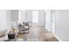 Bright hallway with light wood floors and modern seating at 1838 Race St, Denver, CO 80206