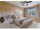 This bedroom has a neutral palette and modern furniture, creating a serene and inviting space at 9461 Ashbury Cir # 104, Parker, CO 80134