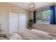 Bedroom featuring closet, natural light from a window, and a calming color scheme to create a relaxing retreat at 9461 Ashbury Cir # 104, Parker, CO 80134