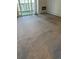 Bright living room featuring neutral carpet, sliding doors, and access to an outdoor space at 9340 E Center Ave # 8B, Denver, CO 80247