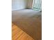 Bright living room featuring neutral carpet, sliding doors, and access to an outdoor space at 9340 E Center Ave # 8B, Denver, CO 80247