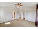 Bedroom features closet, access to ensuite bath, and neutral toned carpet at 9102 W 107Th Pl, Broomfield, CO 80021