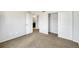 Bedroom view featuring a closet and door leading to an ensuite bathroom at 9102 W 107Th Pl, Broomfield, CO 80021