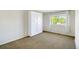 Bedroom featuring a built-in wardrobe and window with white curtains at 9102 W 107Th Pl, Broomfield, CO 80021
