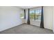 Bright bedroom features large windows with views and neutral carpet at 9102 W 107Th Pl, Broomfield, CO 80021