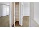 Neutral closet with shelving and access to other rooms at 9102 W 107Th Pl, Broomfield, CO 80021