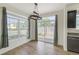 Well-lit dining area featuring abundant windows, stylish fixtures, and seamless flooring for a refined dining experience at 9102 W 107Th Pl, Broomfield, CO 80021