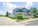 Well-manicured townhome featuring a white picket fence, lovely landscaping, and a charming exterior at 9102 W 107Th Pl, Broomfield, CO 80021
