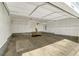 Spacious garage with ample storage and overhead shelving at 9102 W 107Th Pl, Broomfield, CO 80021