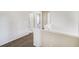 Open hallway offering access to various rooms, showcasing neutral carpet and painted walls at 9102 W 107Th Pl, Broomfield, CO 80021