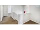 Hallway with neutral carpet and railing with views of rooms in the home at 9102 W 107Th Pl, Broomfield, CO 80021