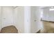 Bright hallway with closet storage, wood floors, and entrance to the home at 9102 W 107Th Pl, Broomfield, CO 80021
