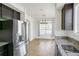 Bright kitchen with granite countertops, stainless steel appliances, and an open dining area at 9102 W 107Th Pl, Broomfield, CO 80021