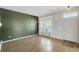Comfortable living room showcasing natural light, sleek flooring, and a serene ambiance for relaxation and comfort at 9102 W 107Th Pl, Broomfield, CO 80021