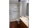 Accessible bathroom featuring a walk-in shower with safety bar at 10650 E Tennessee Ave # 101, Aurora, CO 80012