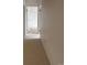 Hallway showcasing neutral carpet, white walls, and doors leading to other rooms at 10650 E Tennessee Ave # 101, Aurora, CO 80012