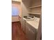 Convenient in-unit laundry closet with modern washer and dryer at 10650 E Tennessee Ave # 101, Aurora, CO 80012