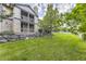 Stunning condo exterior with stone accents, balconies, and lush green landscaping at 7418 S Quail Cir # 1312, Littleton, CO 80127