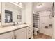 Clean and bright bathroom with a vanity, toilet, and shower-tub combo at 7418 S Quail Cir, Littleton, CO 80127