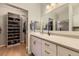 Clean bathroom with ample storage and walk-in closet with lots of shelving at 7418 S Quail Cir, Littleton, CO 80127