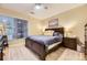 Comfortable bedroom features a plush bed, soft lighting, and an area rug at 7418 S Quail Cir, Littleton, CO 80127