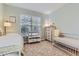 room with crib, single bed, and dresser next to large window at 7418 S Quail Cir, Littleton, CO 80127