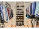 A well organized walk-in closet with custom shelving and storage at 7418 S Quail Cir, Littleton, CO 80127