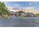 Inviting community clubhouse featuring ample parking and a welcoming entrance at 7418 S Quail Cir, Littleton, CO 80127