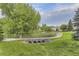 A serene community scene featuring a scenic bridge and lush landscaping at 7418 S Quail Cir, Littleton, CO 80127