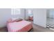 Bright bedroom featuring a mirrored closet, soft carpet, and neutral color scheme with modern lighting at 7845 Conifer Rd, Denver, CO 80221