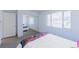 Bright bedroom with a mirrored closet, soft carpet, a large window and lots of natural light at 7845 Conifer Rd, Denver, CO 80221