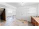 Spacious kitchen area with tile floors, cabinets, and a convenient sink and window at 7845 Conifer Rd, Denver, CO 80221