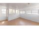 Sunroom features many windows and tile floors at 7845 Conifer Rd, Denver, CO 80221