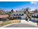 Charming two-story home features a well-manicured front yard and attached two-car garage at 1494 S Yampa Ct, Aurora, CO 80017