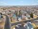 Aerial view of homes, streets and roads in the surrounding neighborhood at 17127 Yellow Rose Way, Parker, CO 80134