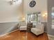 Cozy seating area with hardwood floors, a large window, and stylish decor creating a warm atmosphere at 17127 Yellow Rose Way, Parker, CO 80134