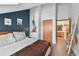 Inviting bedroom featuring a queen-sized bed, ensuite bathroom, and stylish decor at 100 S Park Ave # E312, Breckenridge, CO 80424