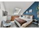 Bright bedroom with skylight, a wooden dresser, and a comfortable queen-sized bed at 100 S Park Ave # E312, Breckenridge, CO 80424