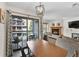 Dining room leading to sliding doors to balcony with view of fireplace and living room at 100 S Park Ave # E312, Breckenridge, CO 80424
