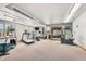 Bright gym with exercise equipment, windows, and outside access at 100 S Park Ave # E312, Breckenridge, CO 80424