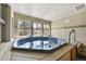 Indoor hot tub room with multiple windows at 100 S Park Ave # E312, Breckenridge, CO 80424