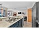 Kitchen with open floor plan to living room and stainless steel appliances at 100 S Park Ave # E312, Breckenridge, CO 80424