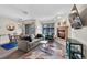 Comfortable living room with a cozy fireplace adjacent to dining area with sliding doors to balcony at 100 S Park Ave # E312, Breckenridge, CO 80424