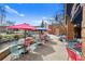 Charming patio featuring an outdoor seating area alongside a tranquil creek, perfect for relaxation and dining at 100 S Park Ave # E312, Breckenridge, CO 80424