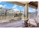 Inviting balcony with wood floors and wrought iron railing offers neighborhood views and relaxing outdoor space at 11250 Florence St # 28F, Commerce City, CO 80640