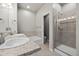 Bright bathroom with double sinks, granite countertops, framed mirror, tile floor and a shower at 11250 Florence St # 28F, Commerce City, CO 80640