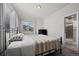 Comfortable bedroom with neutral walls, carpet, and a TV on a stand at 11250 Florence St # 28F, Commerce City, CO 80640