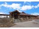 Stone clubhouse exterior with a welcoming entrance and well-manicured landscaping offers an inviting space for gatherings at 11250 Florence St # 28F, Commerce City, CO 80640